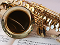  saxophone laying on a sheet of music